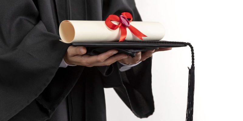 close-up-woman-with-graduation-diploma